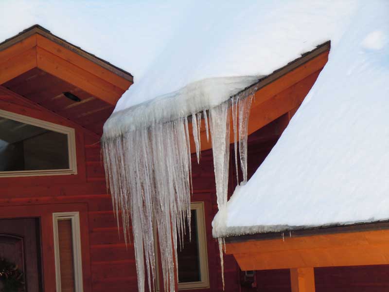 Icicles and ice dams forming up the roof.