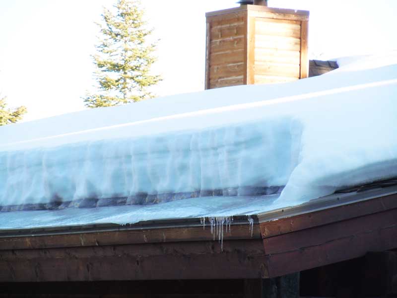 Icicles and ice dams forming up the roof.